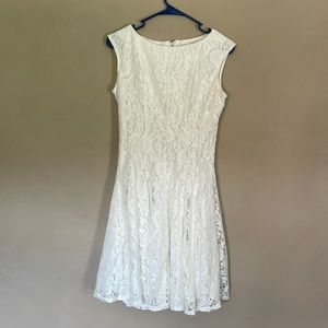 Elegant lace white dress, flowy loose bottom, perfect for any occasion